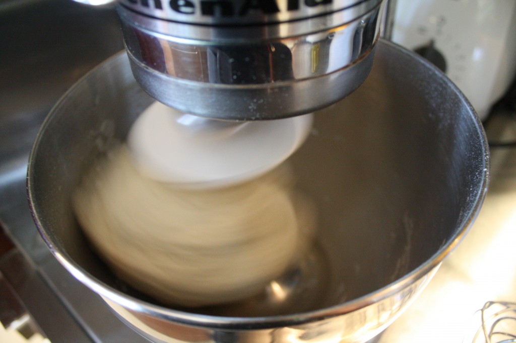 Knead. Or take the lazy route, throw it in the Kitchen Aid with the dough hook.