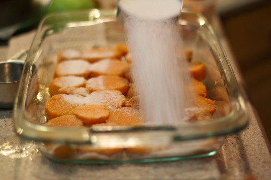 The parboiled yams are sprinkled with sugar