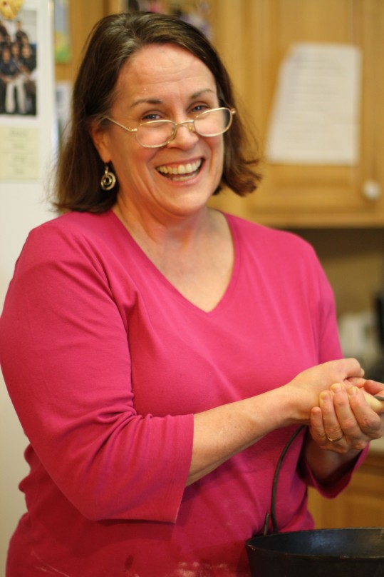 This is Nancie, smiling away while cooking 8 things at one time!