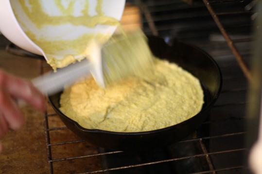 The cornbread mixture goes straight into a very hot pan